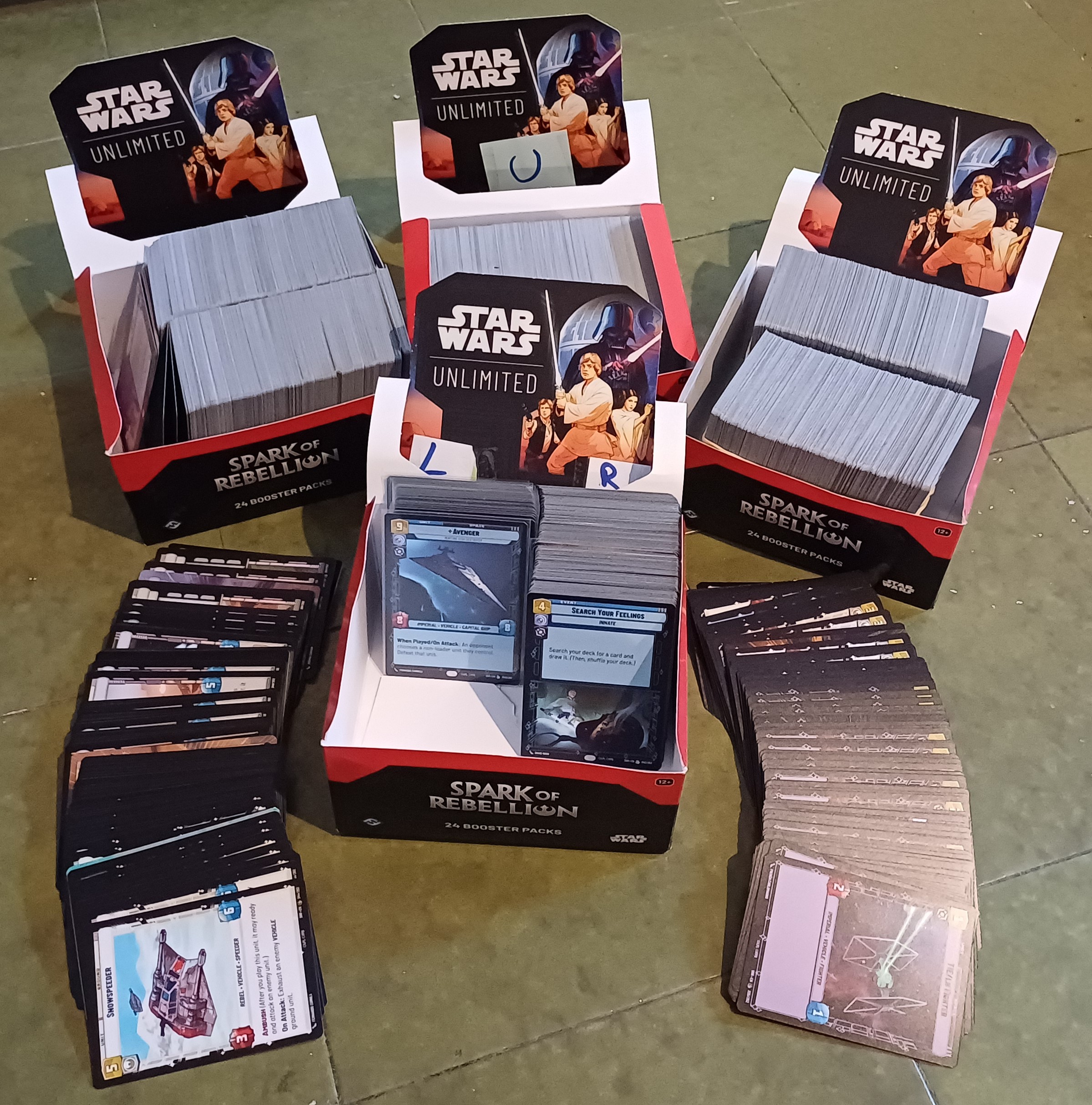 Physical Star Wars Unlimited card collection spread out for cataloguing and valuation